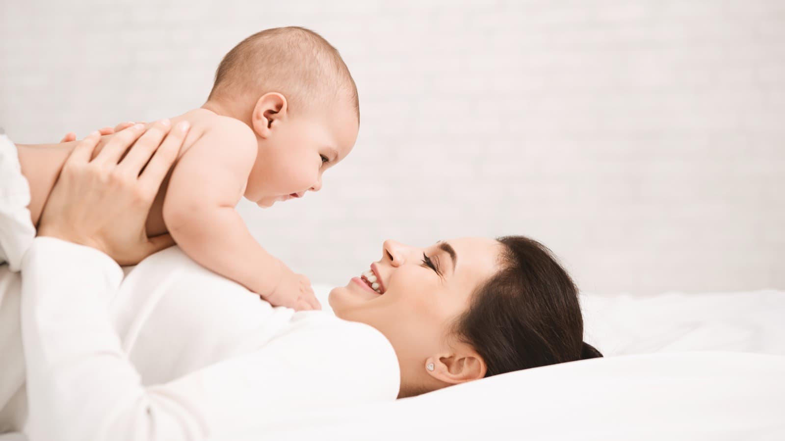 Smiling mother and baby